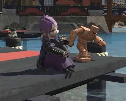 Runi sitting on a dock